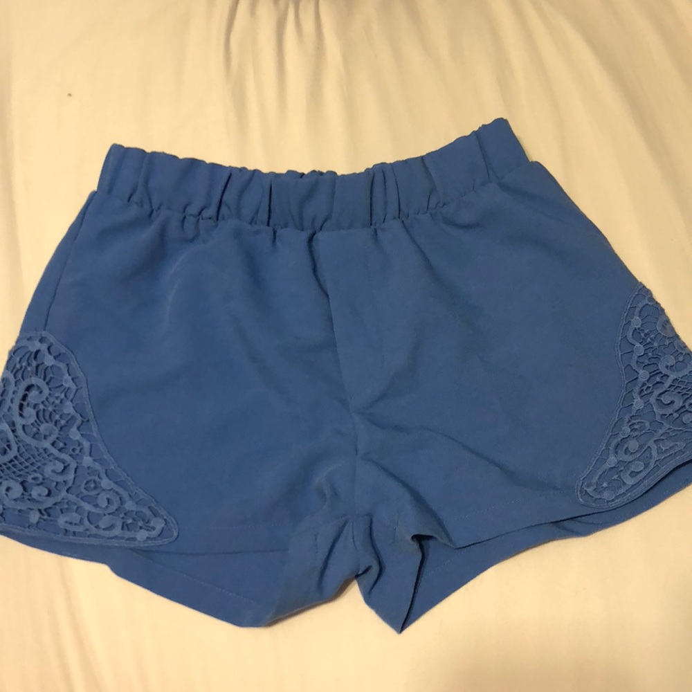 Blue high waisted shorts with lace detail